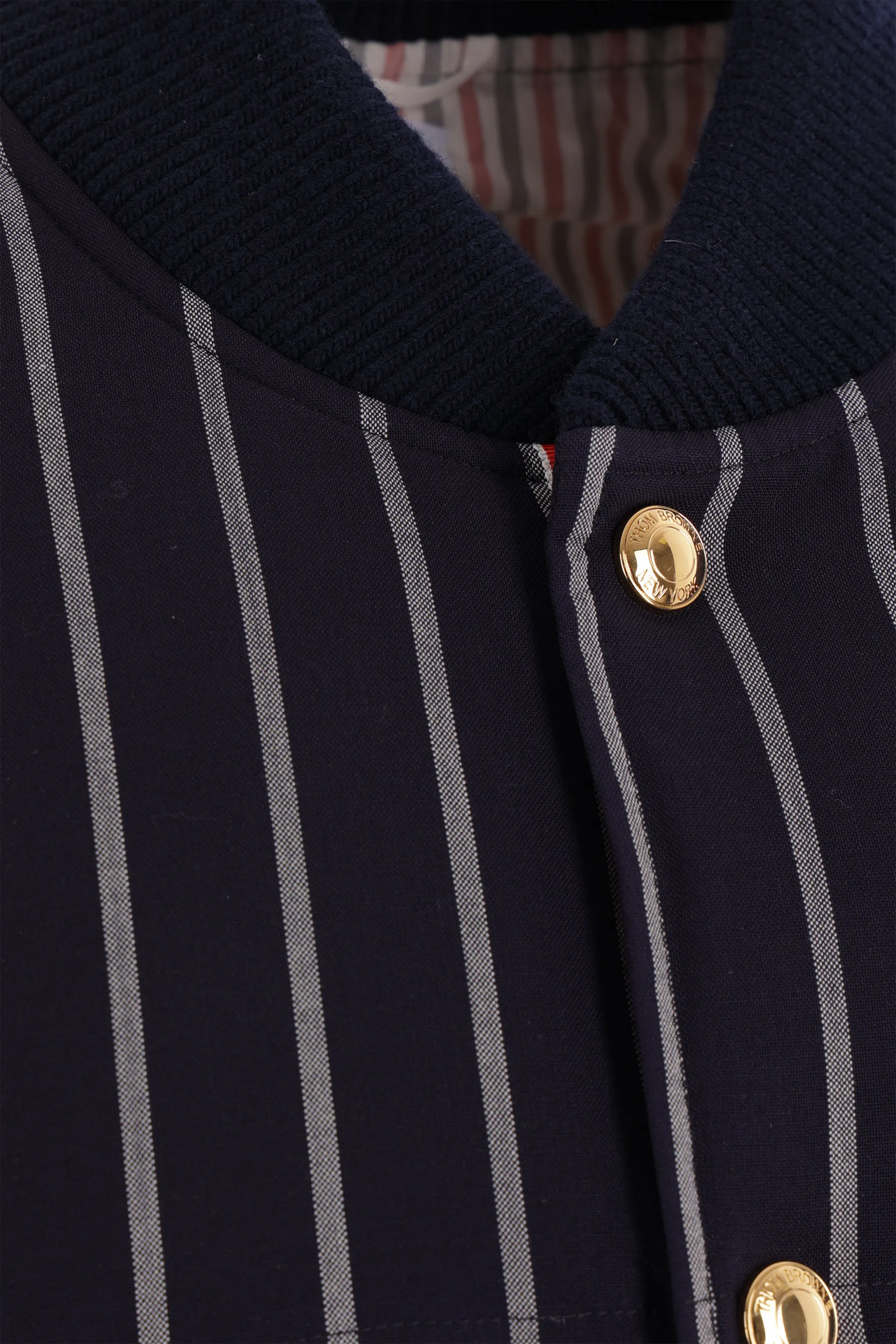 THOM BROWNE piumino smanicato in lana a righe