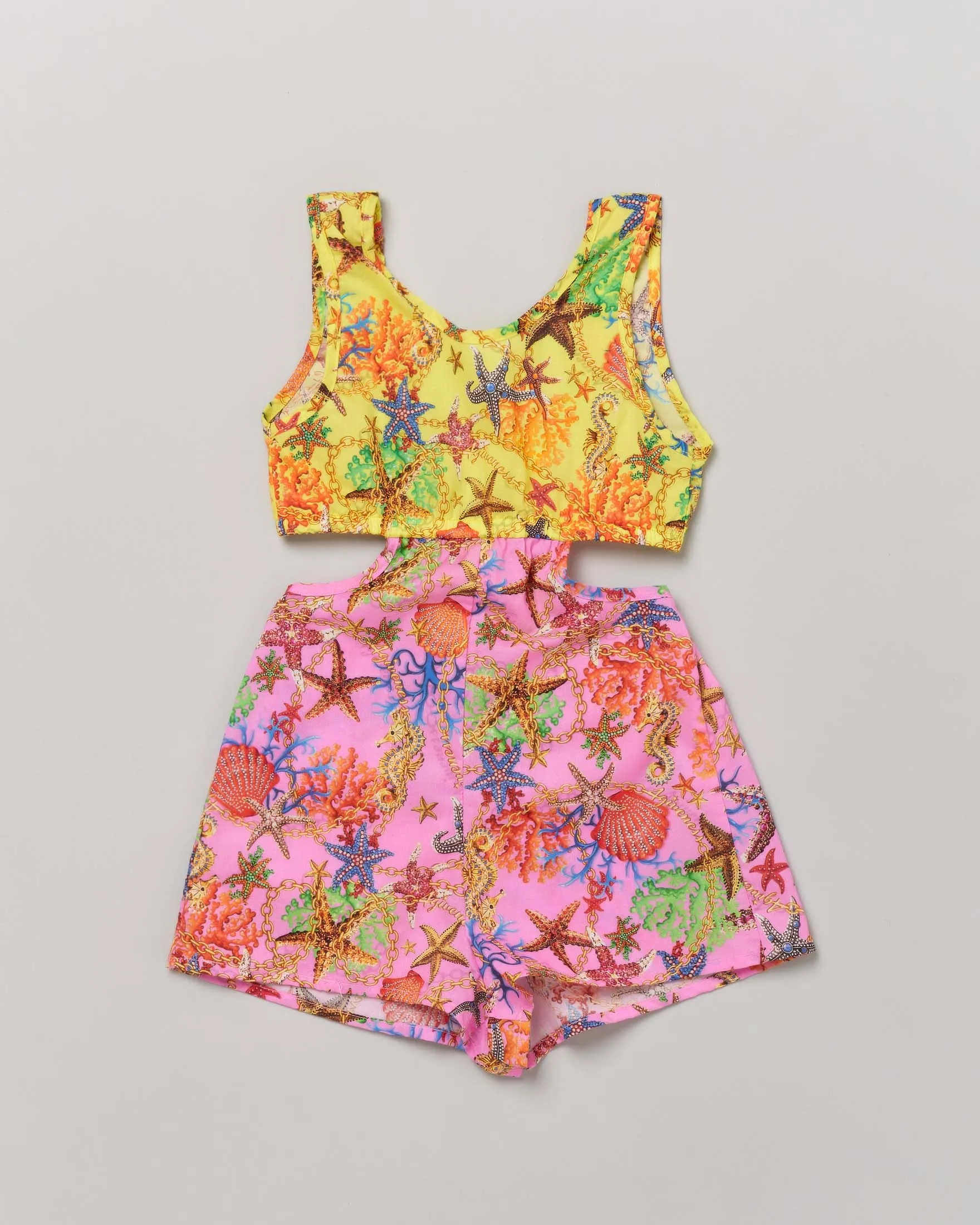 Tutina copricostume gialla e fucsia a fantasia stelle marine con cut-out ai fianchi 6-10 anni