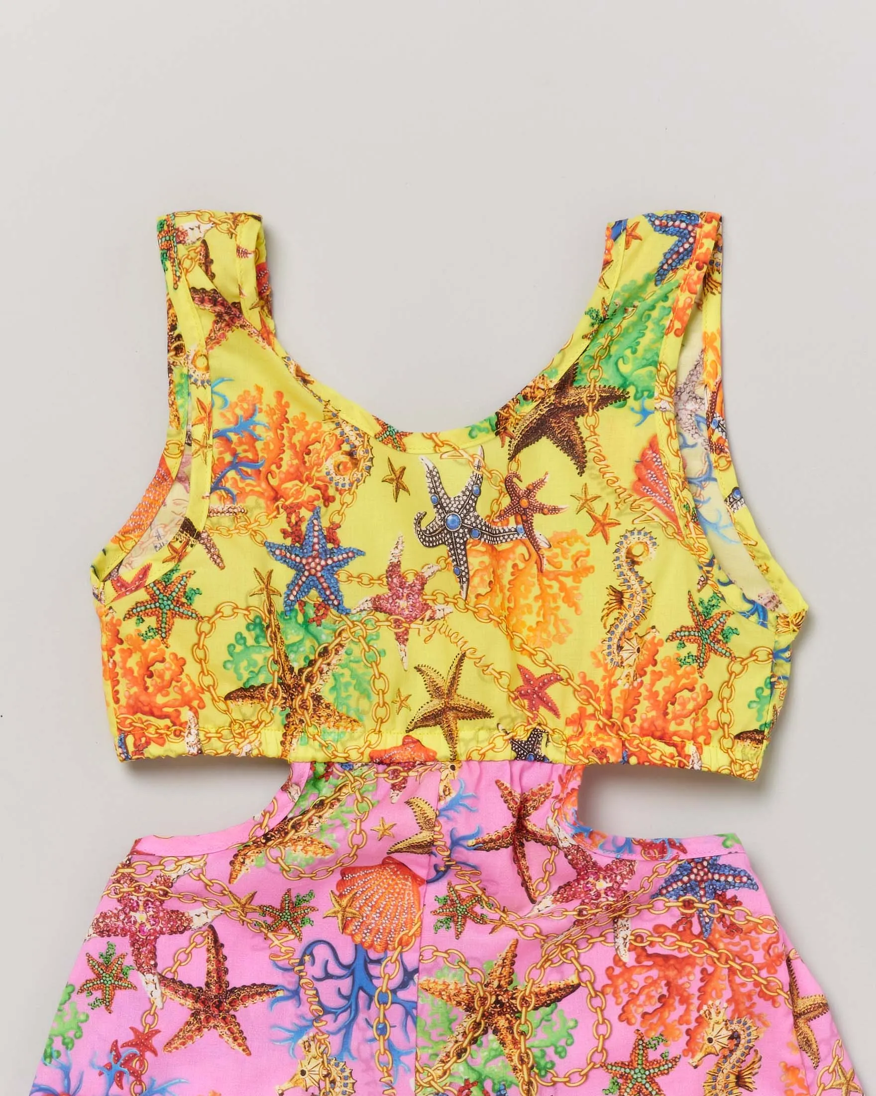 Tutina copricostume gialla e fucsia a fantasia stelle marine con cut-out ai fianchi 6-10 anni